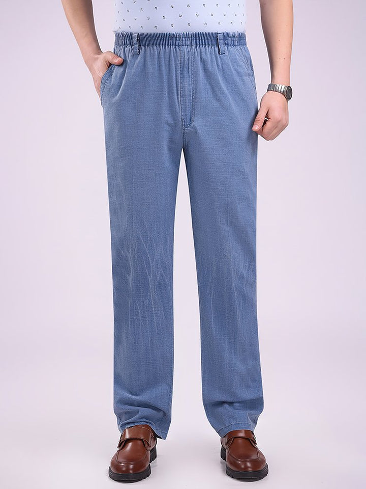 Pantalones casuales holgados de cintura alta con elástico de algodón de mezclilla de imitación para hombre