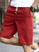 Pantalones cortos casuales con cordón y cintura elástica de color sólido para hombre