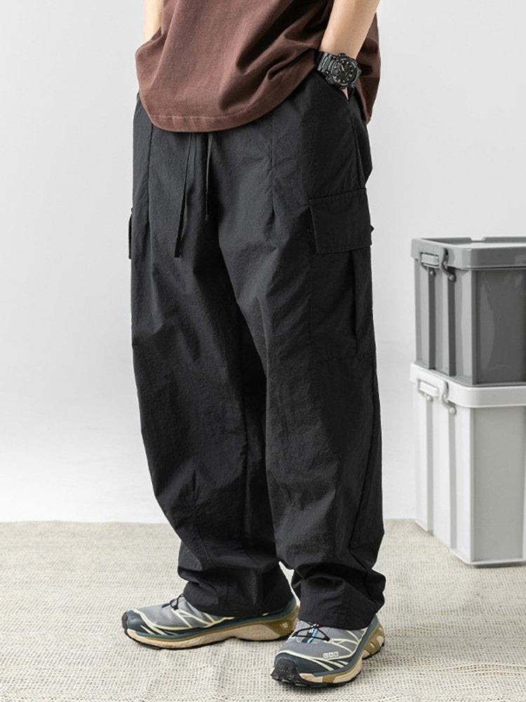 Pantalones de trabajo informales con bolsillos tridimensionales, sueltos y con diseño plisado para exteriores para hombre