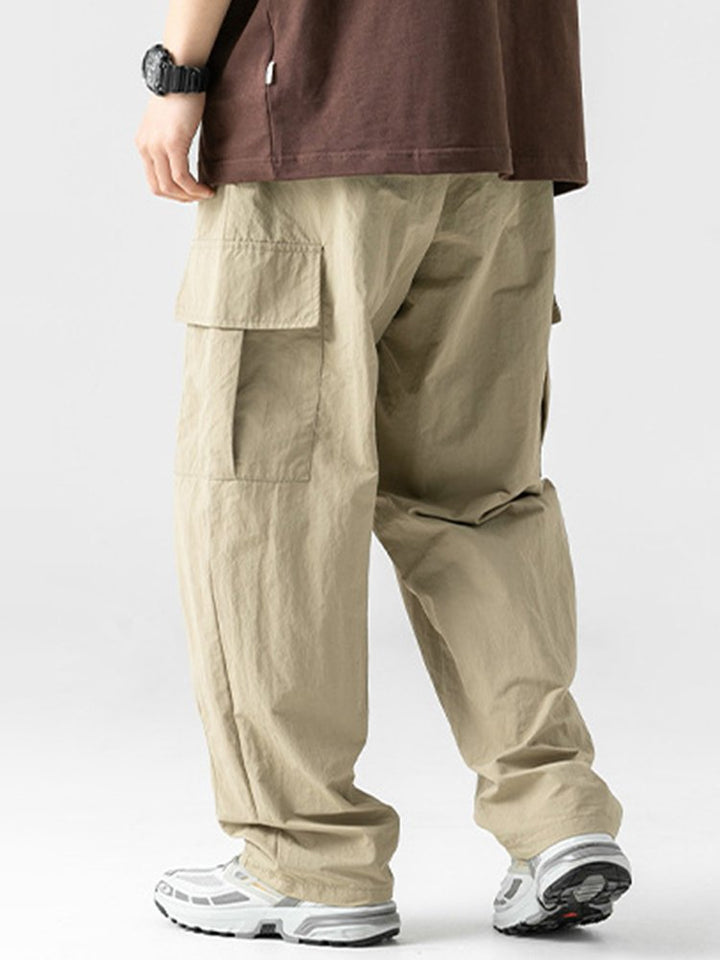 Pantalones de trabajo informales con bolsillos tridimensionales, sueltos y con diseño plisado para exteriores para hombre